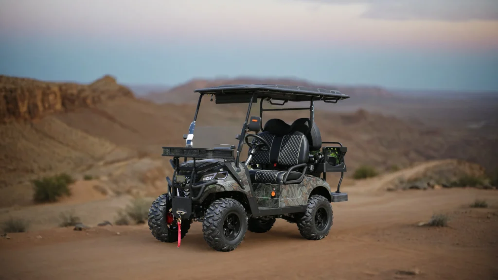 off road electric golf cart traversing a snow covered mountain trail, rugged tires cutting through the snow, snow capped trees in the background, cold winter sunlight shining through — 16 9